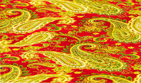Paisley green pattern on a red background. decorated the bandanas of cowboys and bikers popularized by The Beatles, ushered in the era of hippies and became the emblem of rock and roll.の写真素材