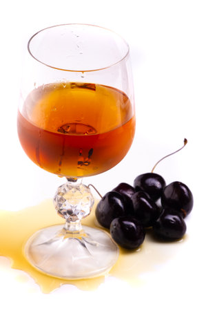 Enjoy a refreshing cocktail of cognac and cherries. Serve in a stylish glass with a garnish of fresh fruit. The perfect drink to pair with food or enjoy on its own. Rich sweet tasteの写真素材