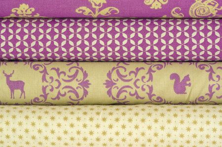 Mix fabrics. Shop counter. Many fabrics of different types. View from above. Printed, cotton, mixed...