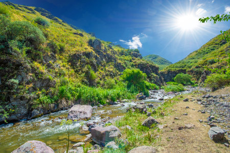Experience the serene flow of the river through a rocky canyon. Immerse yourself in the beauty of nature surrounded by majestic mountains. Feel a sense of peace and tranquility,の写真素材