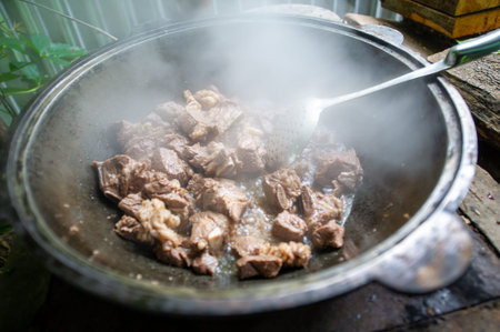 Traditional cooking method using a cauldron and fire. The aroma of smoke is inherent in lamb meat....