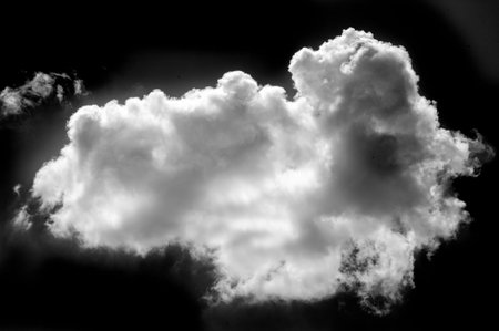 White cloud on a black background. Stunning visual contrast with white cloud on black background....