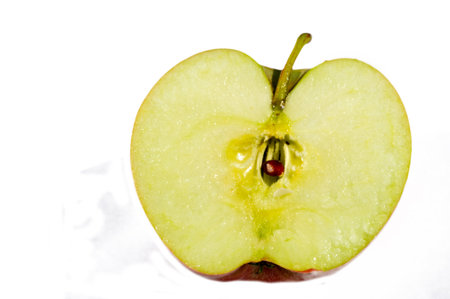 White background for a clean and fresh look Red apple symbolizing health and vitality Rich in vitamins and nutrients Juicy and ripe for maximum flavor and freshnessの写真素材