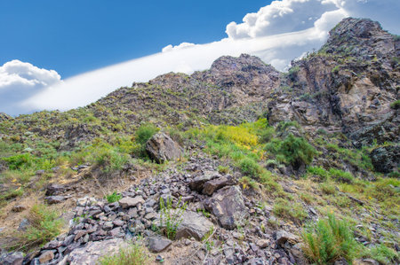 Experience off-road adventure in rugged terrain. Enjoy stunning views of the surrounding mountains. Challenge yourself on steep climbs and descents. Enjoy the thrill of navigating rocky obstacles.の写真素材