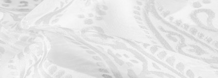 Silk fabric, snow-white fabric. Shades of delicate exquisite flowers on a white background, photo of...