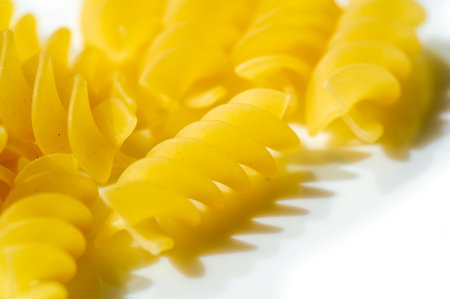 Italian fusilli pasta made from durum wheat. Pair with your favorite sauces for a delicious lunch. The golden color and swirled shape add texture to dishes.の写真素材
