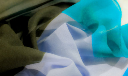 The vibrant blue and black pattern creates a stunning visual impact. The unique pleating technique enhances depth and texture. Perfect for fashion, upholstery or home decor projects.の写真素材