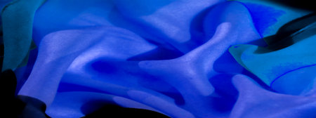Featuring a bold, vibrant pattern in blue and black. Creates depth and texture through innovative pleating techniques. High contrast between colors enhances visual appeal.の写真素材