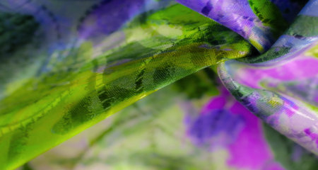 A folded purple fabric with a smooth texture and intricate design, creating shadows and reflections...