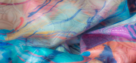 Close-up of a vibrant multicolored abstract fabric with swirling patterns. Textures blend warm and...