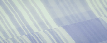 Soft fabric with fine, evenly spaced stripes in shades of blue and white, gently gathered.