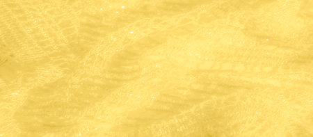 Blur of soft yellow fabric with golden sparkles across its rich texture. The subtle shimmer and...