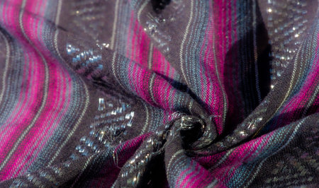 Blur the vivid stripes of magenta and blue set against black fabric. The shimmering elements weave...