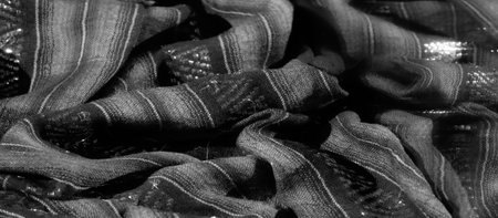 Blur: Textured black and gray striped fabric with intricate reflective details. The woven zigzag patterns enhance the depth and give a polished, high-end feel to this versatile material.の写真素材