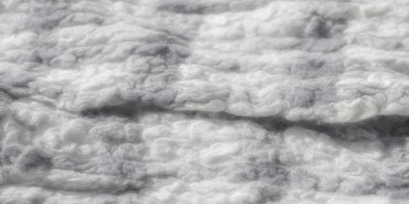 Blur of a fabric pattern in grayscale tones, capturing the subtle complexity of the woven fibers. The soft, fluffy texture is enhanced by the interplay of light and shadow,の写真素材