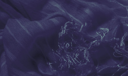 Blur: The fabric showcases deep blue tones with soft light streaks running across the surface. Its flowing texture and subtle patterns evoke an elegant and calming visual effect.の写真素材
