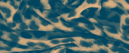 Blur the intricate folds of fabric with leopard-like spots in muted tones of blue and beige, creating a calming and abstract appearance. The flowing design gives a sense of movement and fluidity.の写真素材