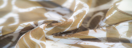 Blur Soft, light-brown fabric with a translucent texture flows in delicate waves, creating a...