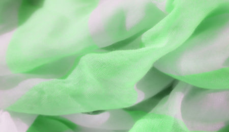 Blur of light green and white fabric intertwined in soft, flowing waves. The smooth texture and vibrant colors provide a modern, seamless pattern perfect for textile and fashion design.の写真素材