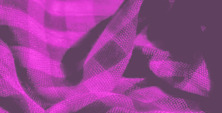 Blur The softness of this purple fabric is highlighted by its delicate woven texture and flowing folds. The interplay of light and shadow adds depth to this beautiful textile.の写真素材