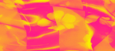 Blurred neon pink and yellow fabric overlaps with floral patterns, creating a glowing, layered...