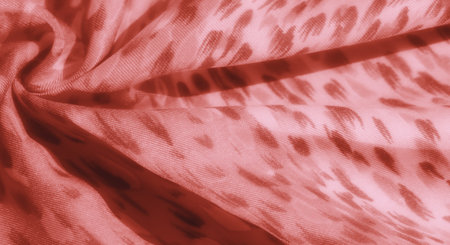 Blur of sophisticated red fabric, featuring a soft, organic pattern that complements its luxurious folds. Perfectly suited for high-end fashion and decor inspiration.の写真素材