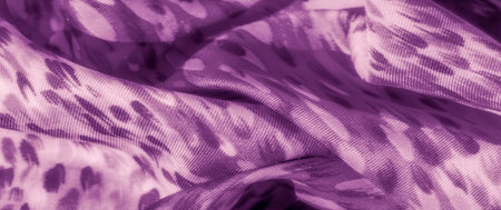 Blur of purple fabric with leopard-inspired patterns, skillfully draped and folded, presenting a...