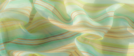 Blur of a green and yellow striped fabric with a translucent, flowing texture. Light enhances the...