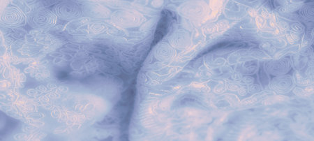 Blur of a soft blue lace fabric with swirling floral embroidery, enhanced by gentle highlights that bring out the fine details. The intricate patternの写真素材