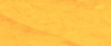 Blur. Soft, swirling floral patterns dance across this warm yellow fabric. The texture and folds create a depth that adds sophistication to any interior design scheme.の写真素材