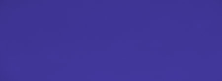 Blur of soft blue fabric with graceful folds, adding a serene and luxurious feel to the image. Perfect for background use, this smooth texture evokes calm and sophistication.の写真素材