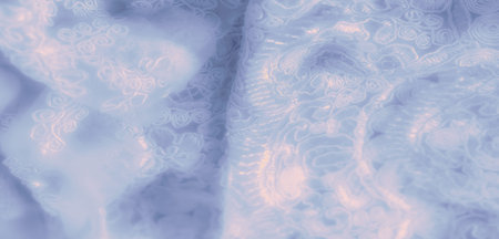 Blur of a delicate lace fabric in soft blue tones, showing intricate floral and swirl embroidery with a gentle sheen. The elegant folds and refined texture add a luxurious touchの写真素材