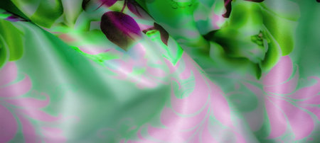 Blur of abstract floral design in green, pink, and purple, blending seamlessly on a soft fabric. Gentle folds add depth, with vibrant colors offering a soothing, fantasy feelの写真素材