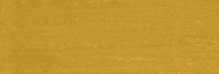 Blur A rich yellow fabric with intricate textures and soft patterns revealing fine detailing that...