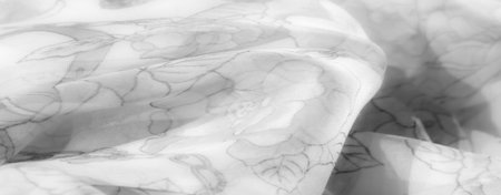 Blur effect reveals the floral arrangements and abstract chain motifs on this fabric, lending a...
