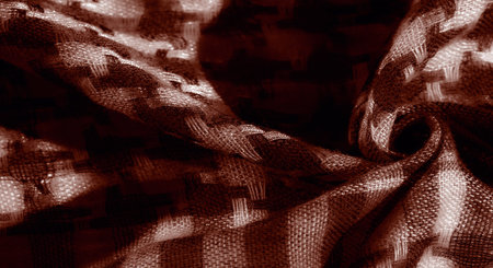 Blur of sepia-toned fabric in a woven design, highlighting smooth, soft textures with light accents that create a dynamic, layered look Vintage and artistic appeal emanates from the textile foldsの写真素材