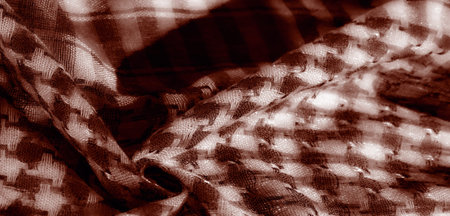 Blur. A close-up shot of a textured fabric in a crosshatch pattern, woven intricately with layers of...