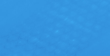 Blur. Close-up of blue fabric with smooth folds and soft textures, creating a minimalist and...