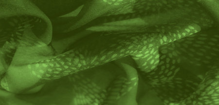 Blur effect brings out the soft texture and natural flow of green fabric with a subtle leaf-like...