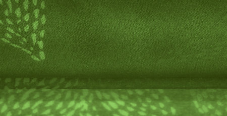 Blurred fabric in soft green, featuring a layered leafy pattern that brings organic softness and...