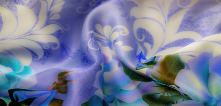 Blur, a captivating view of blue fabric with floral patterns in green and cream. The soft folds and...