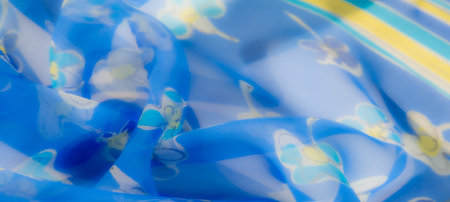 Blur the elegant blue fabric enriched with whimsical floral prints in yellow and white. The...