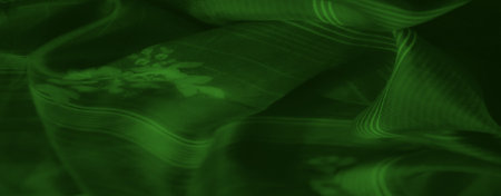 Blur of flowing green fabric with delicate floral accents and striped patterns. The soft, cascading...