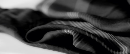 Blur. A grayscale fabric with smooth folds and delicate striped patterns, creating a flowing texture that conveys elegance and minimalistic style.の写真素材