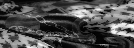 Blur. Featuring a monochrome palette, this fabric combines floral and chain motifs with geometric patterns, creating a dynamic and visually intriguing textile design.の写真素材