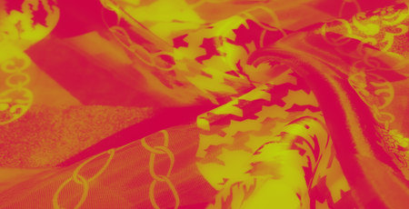 Blur. The vibrant interplay of pink and yellow on patterned fabric creates an abstract, contemporary...