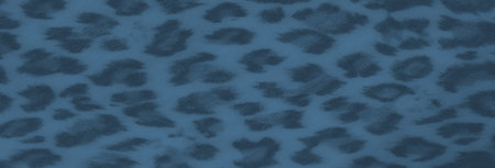 Blur of a detailed fabric surface with animal print and knotted tassels, showing smooth textures and...
