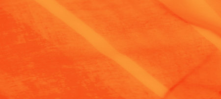 Blur of bright orange satin with flowing folds and a smooth, glossy texture, emanating warmth and...