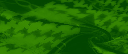 Blurred green fabric featuring dynamic chain links and bold houndstooth patterns. This vibrant...
