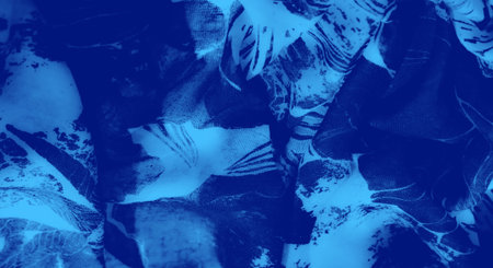 Blurred abstract blue fabric with a grid texture blending seamlessly into fluid, organic shapes. The...